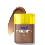 Supergoop! Protec(Tint) Daily SPF Tint with yellow cap on a white background