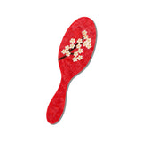 Red sakura blossom hand-painted eco-friendly brush with white floral design on white background