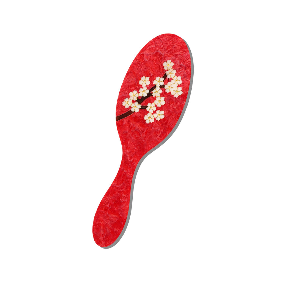 Red sakura blossom hand-painted eco-friendly brush with white floral design on white background