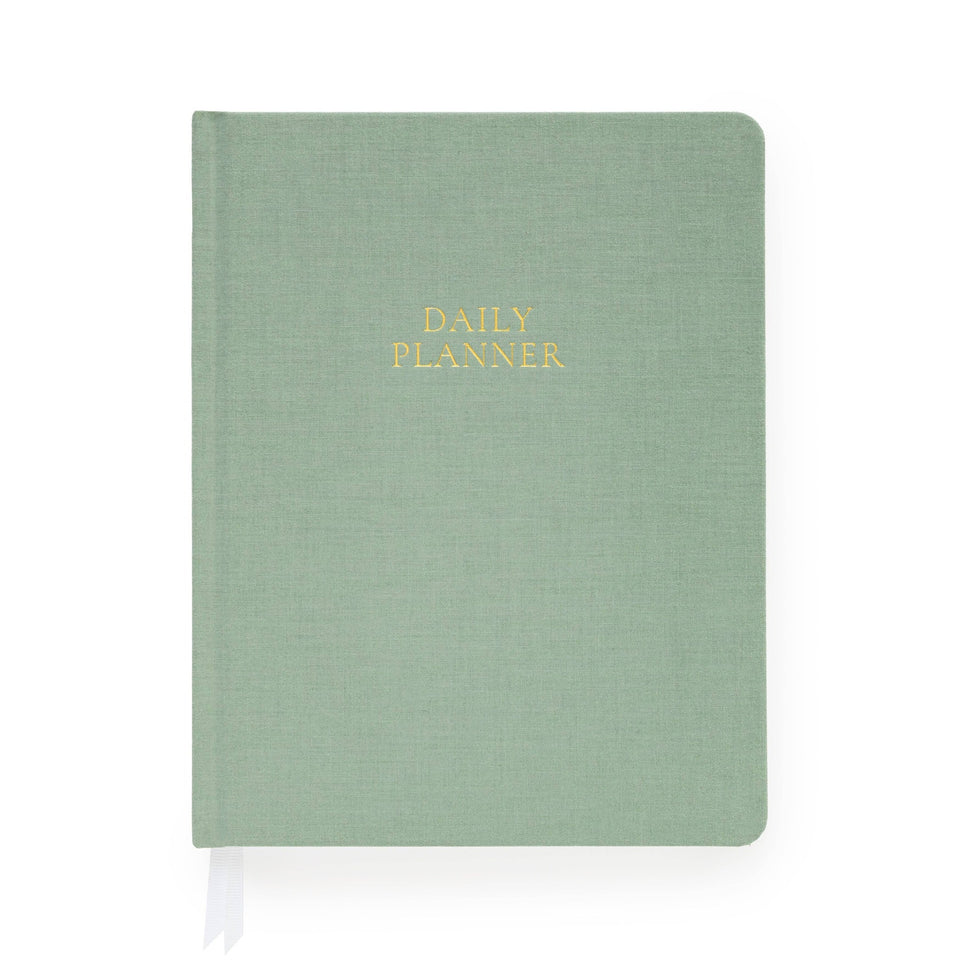 Sage green undated daily planner by Sugar Paper with gold foil text and white ribbon bookmark