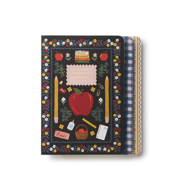 Rifle Paper Co. Schoolhouse notebook with dark cover, colorful floral border, apple and school supplies design