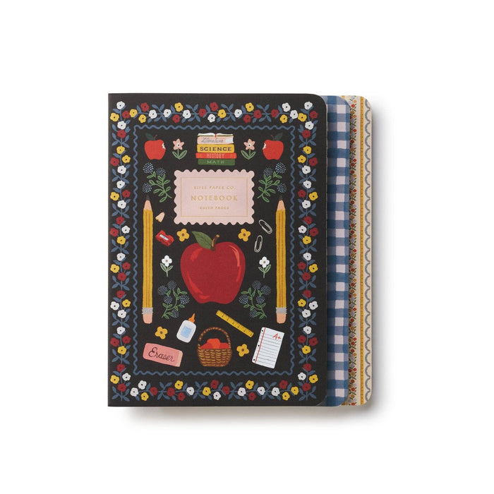 Rifle Paper Co. Schoolhouse notebook with dark cover, colorful floral border, apple and school supplies design