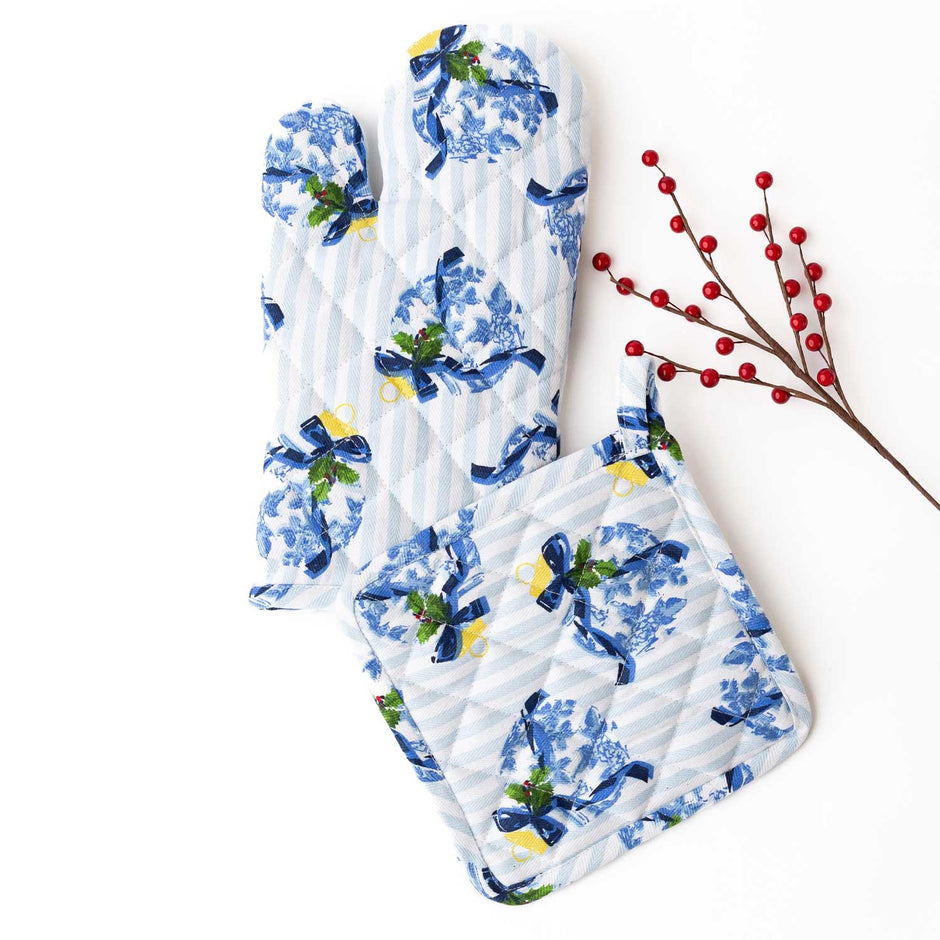 Holiday Chinoiserie oven mitt set with blue and white pattern, yellow accents, and decorative berry sprigs