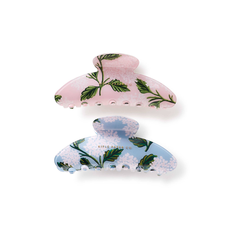 Two floral-patterned hair clips on a white background