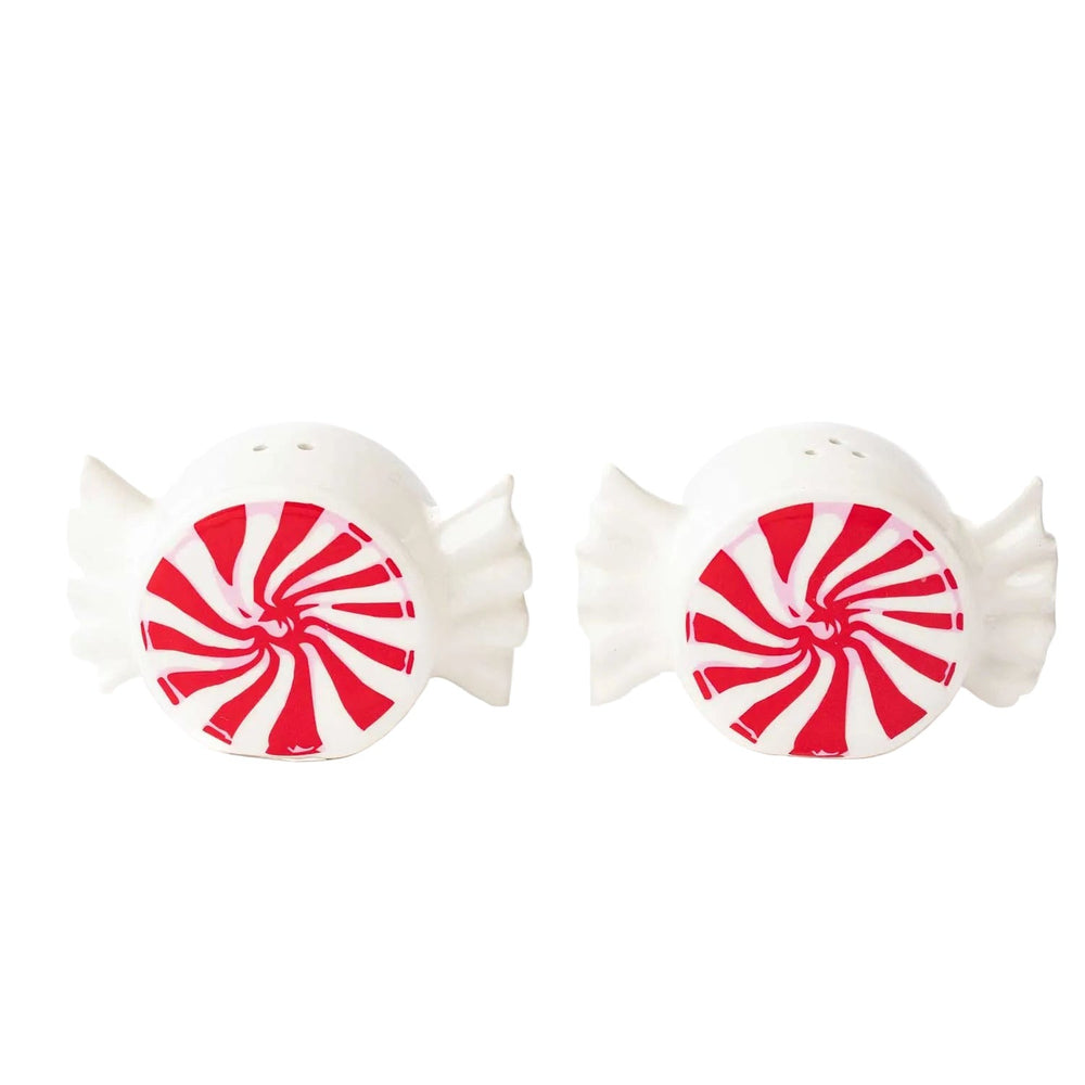 Two white ceramic fish-shaped salt and pepper shakers with red and white peppermint swirl design