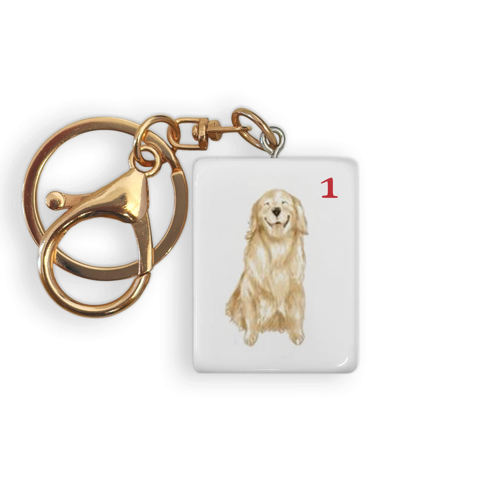 Gold dog mahjong tile keychain with brass ring and chain attachment, numbered 1