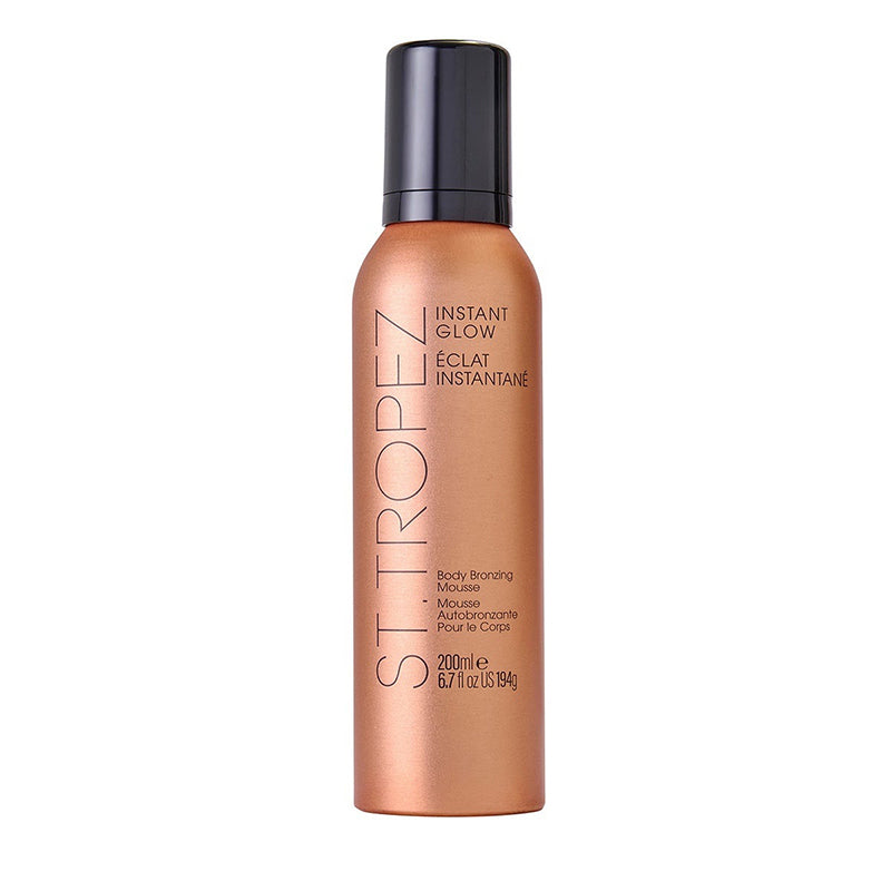 Bronze-colored bottle of body bronzing mousse on a white background
