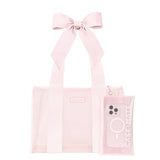 Ballet pink tote bag with bow handles and matching phone case on white background