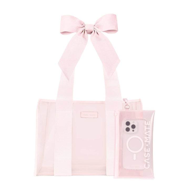Ballet pink tote bag with bow handles and matching phone case on white background