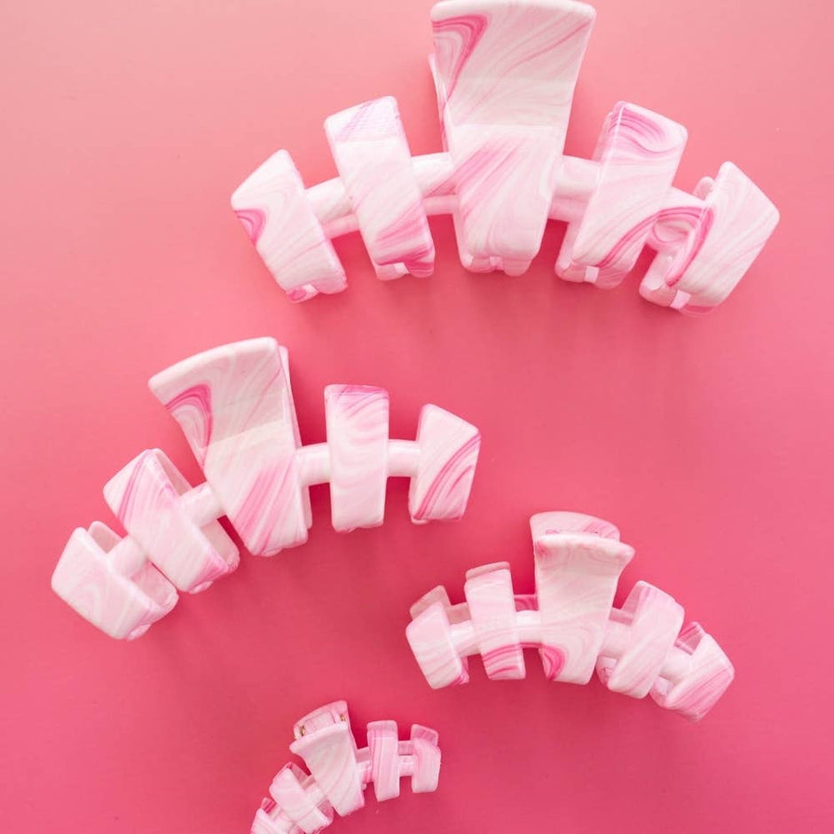 TELETIES Classic Pinch Me! Large Hair Clips in pink and white marble pattern on pink background