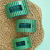 Teleties Cabana Cutie large flat rectangle hair clips in green and yellow stripes on woven texture