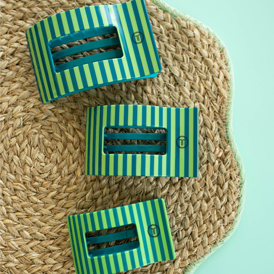 Teleties Cabana Cutie large flat rectangle hair clips in green and yellow stripes on woven texture