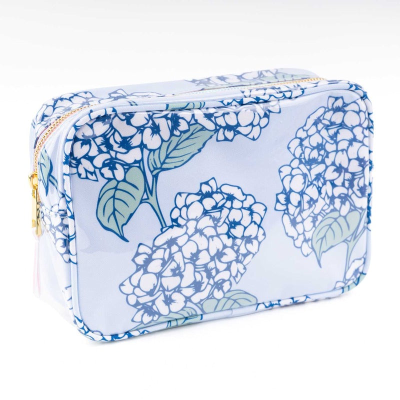 Blue hydrangea print rectangular cosmetic case with gold zipper on white background