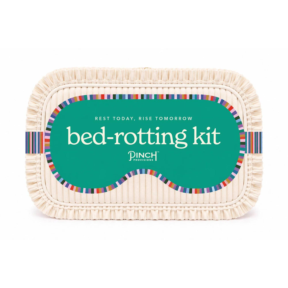 PINCH PROVISIONS Bed-Rotting Kit self-care gift with colorful striped design on cream basket