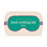 PINCH PROVISIONS Bed-Rotting Kit self-care gift with colorful striped design on cream basket