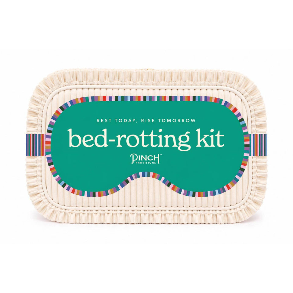 PINCH PROVISIONS Bed-Rotting Kit self-care gift with colorful striped design on cream basket