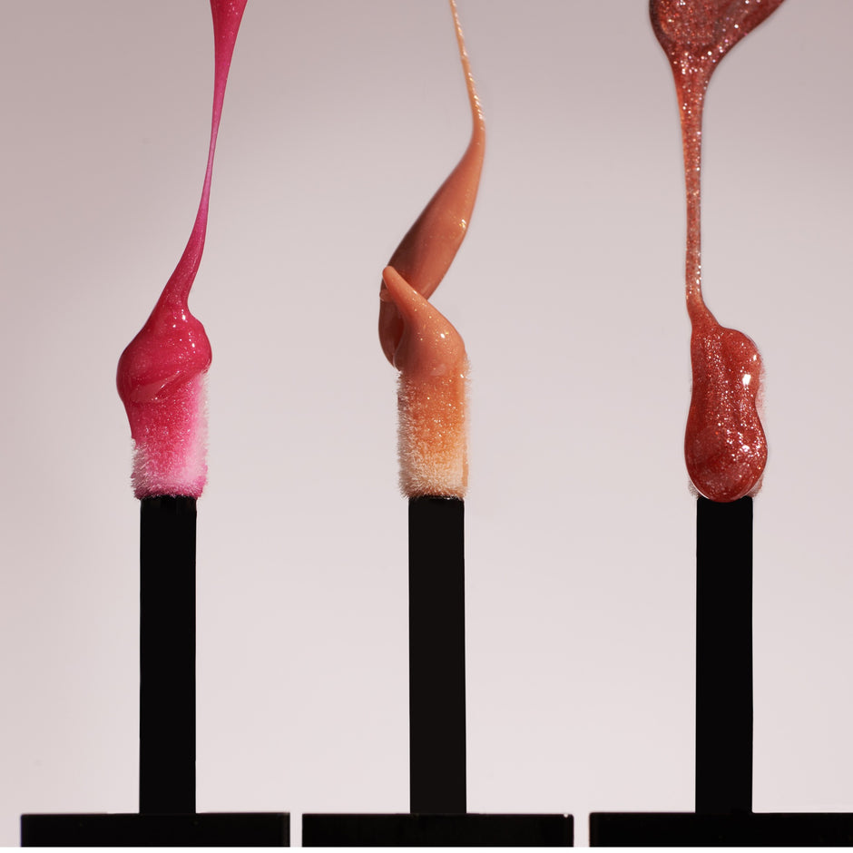 SAINT JANE Lip Shine - Alchemy in three shades displayed on applicator wands against neutral background