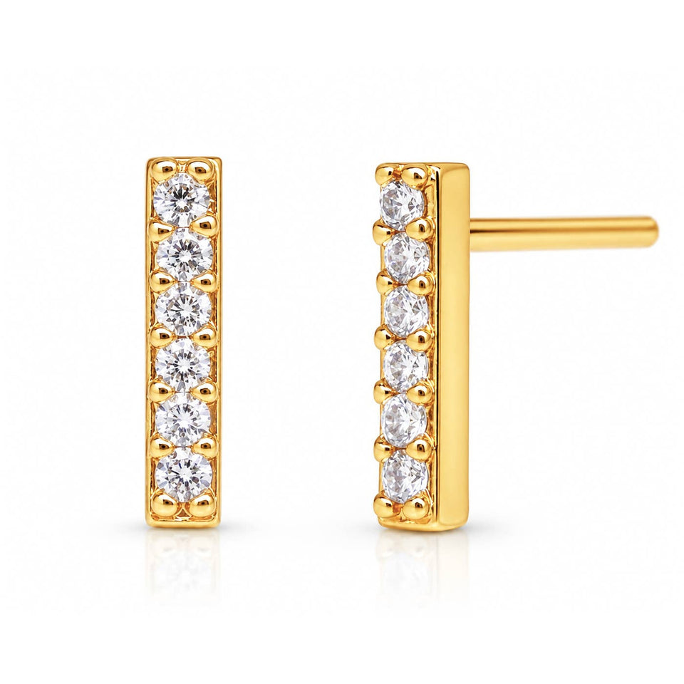 Gold pave stick post earrings with round cubic zirconia stones on white background