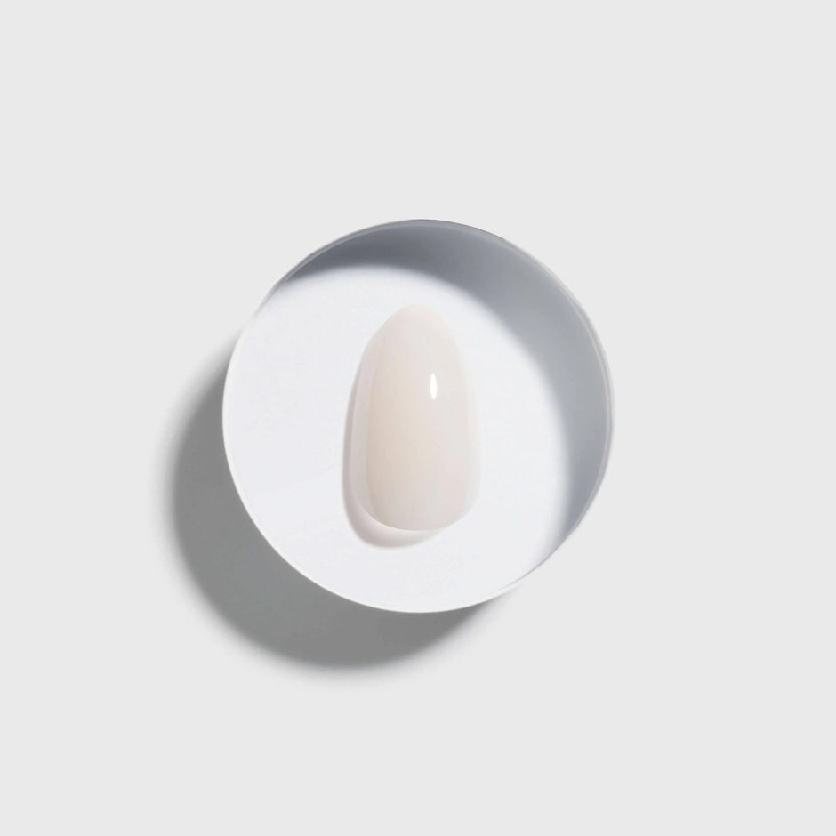 Coconut Milk Extra Short Almond Press On Nails in oval shape on white background