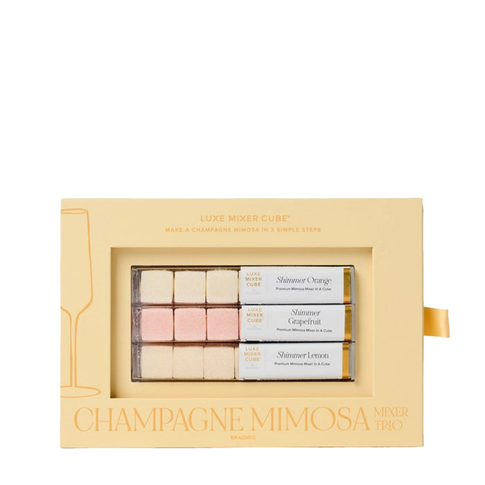 Champagne Mimosa Mixer Kit in a yellow box with three tubes of shimmer cubes