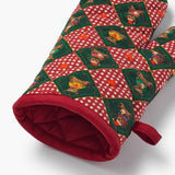 Red and green quilted oven mitt with bear and checkered pattern design
