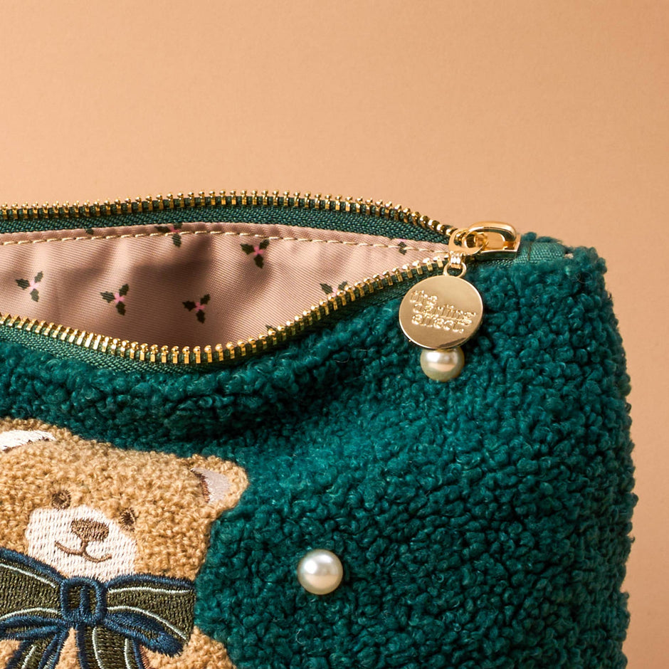 Teddy Pouch Theo with teal textured fabric, pearl accents, and gold zipper detail