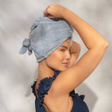Woman wearing Kitsch Plush Microfiber Hair Towel Turban in Coastal Blue after shower