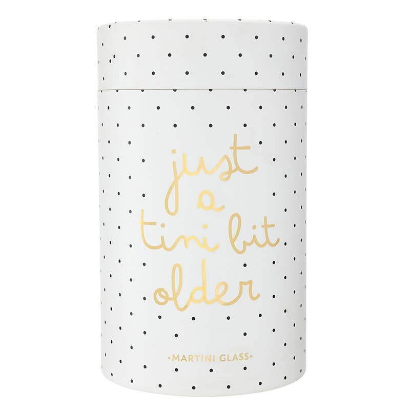 Gold foil martini glass with 'just a tini bit older' text and polka dot pattern design