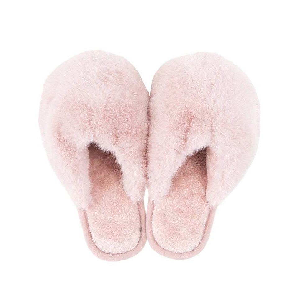 Light pink faux fur women's jumbo slippers viewed from above on white background