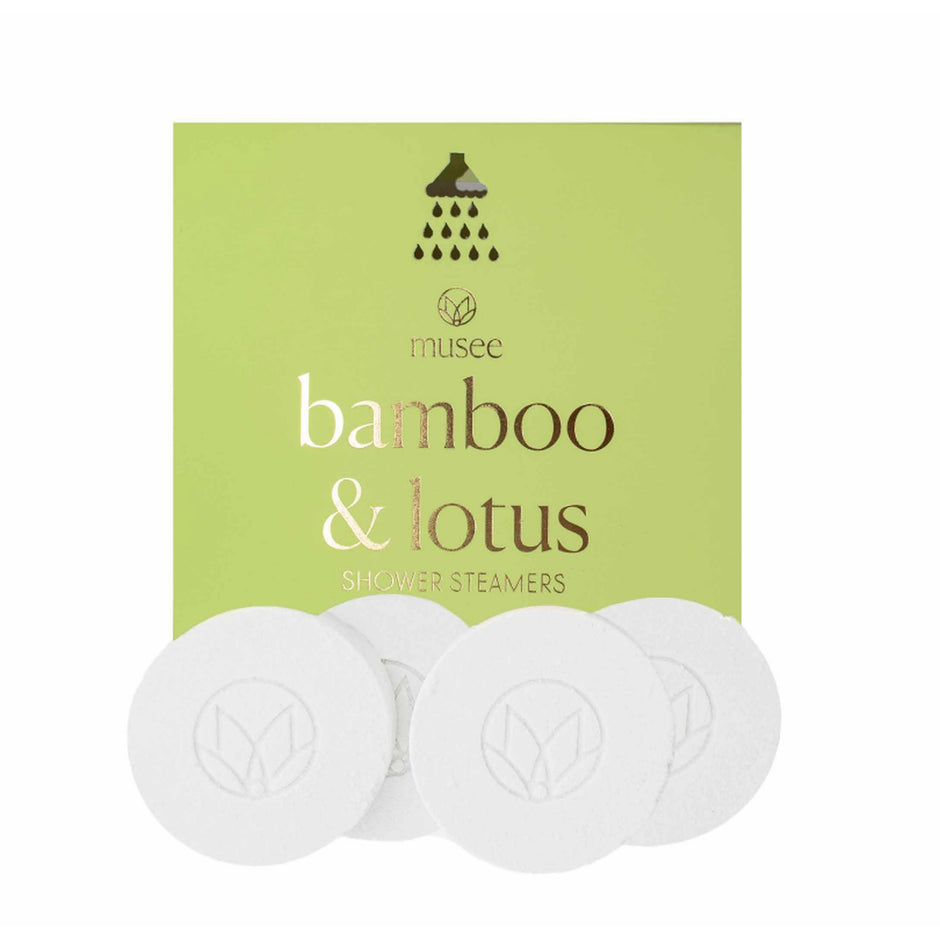 Musee Bamboo & Lotus shower steamers - three white circular aromatherapy discs with product packaging