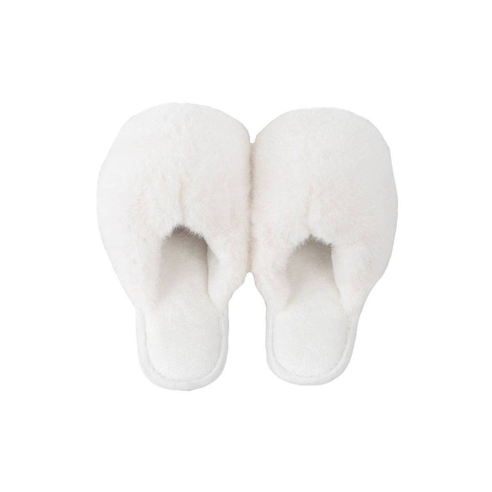White faux fur jumbo slippers with plush padding and open toe design, overhead view