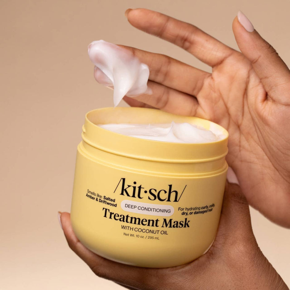 Kitsch Deep Conditioning Treatment Mask with Coconut Oil being held and applied to hair