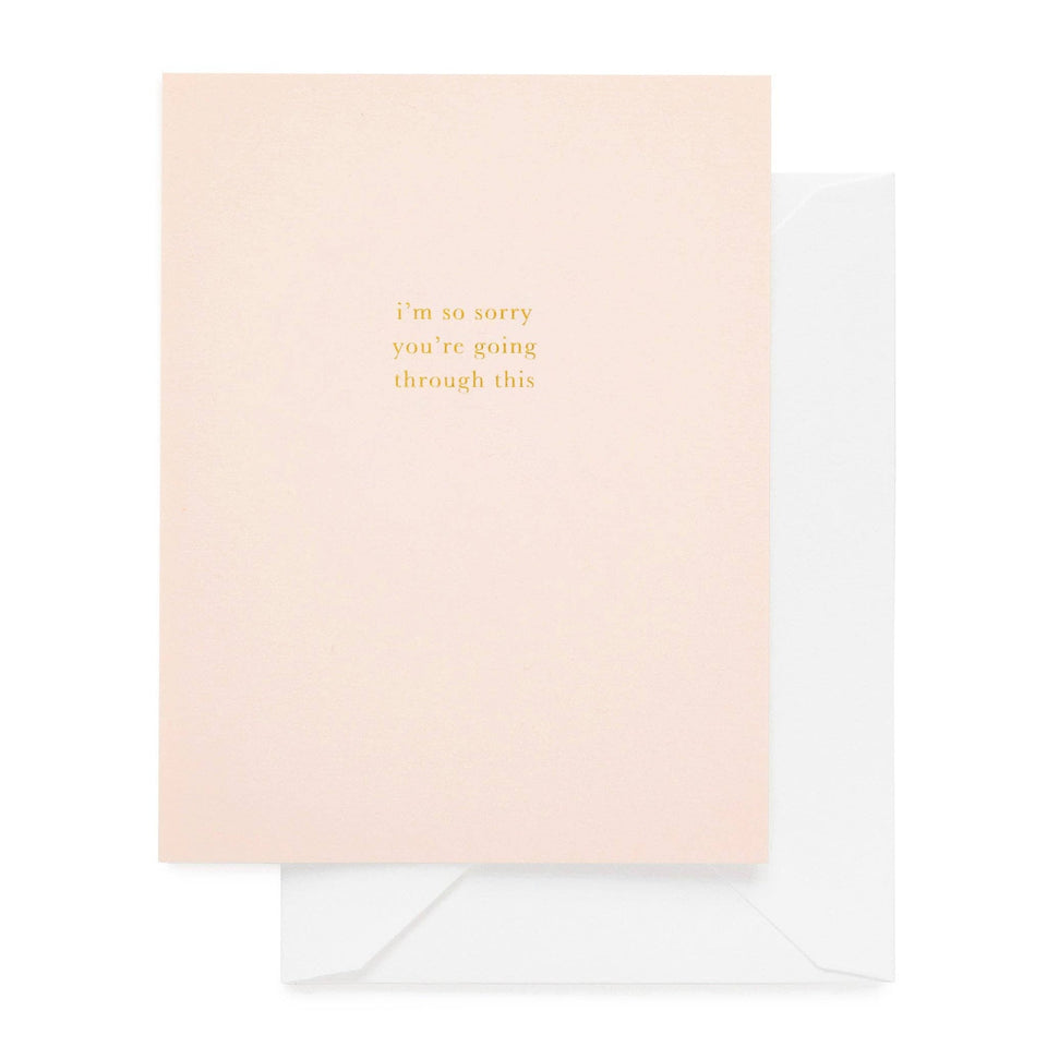 Sugar Paper sympathy card with gold text 'i'm so sorry you're going through this' on pink background