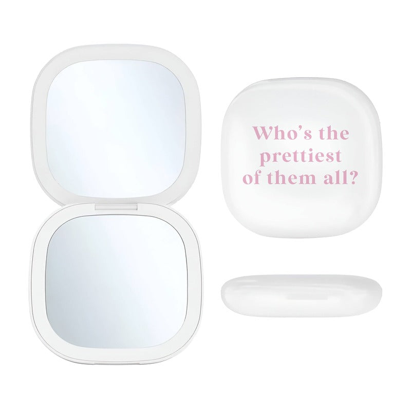 LED compact mirror with pink text overlay 'Who's the prettiest of them all?' displayed open on white background