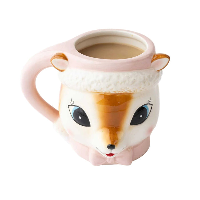 Pink ceramic reindeer mug with gold ears and facial features, filled with coffee