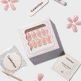 CELEBRITIPS Angel Glaze Dot press-on nails in extra short almond shape with white polka dot design
