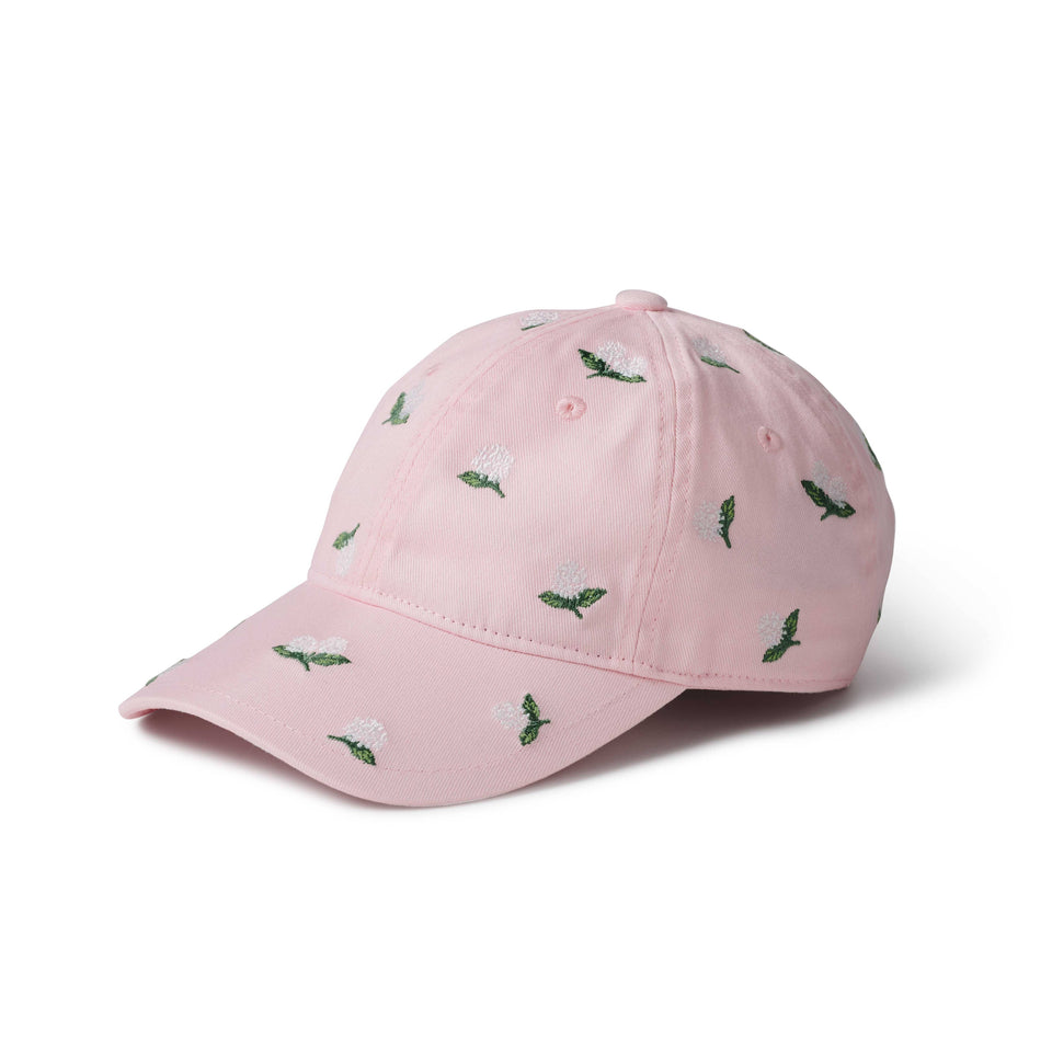 Pink cap with green floral patterns on a white background