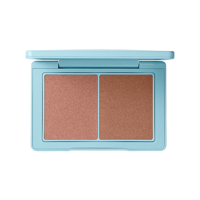 Makeup compact with two shades of bronzer on a white background