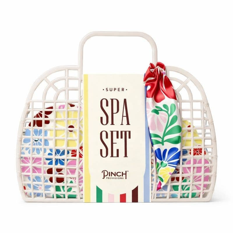 Pinch Provisions Super Spa Set in floral multi design with woven basket and red bow