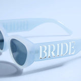 Blue Bride sunglasses with dark tinted lenses and silver embellishments on white background