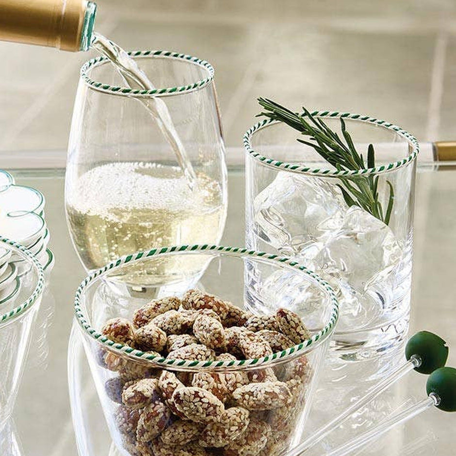 Peppermint Twist green striped DOF glasses styled with wine, appetizers, and fresh rosemary garnish