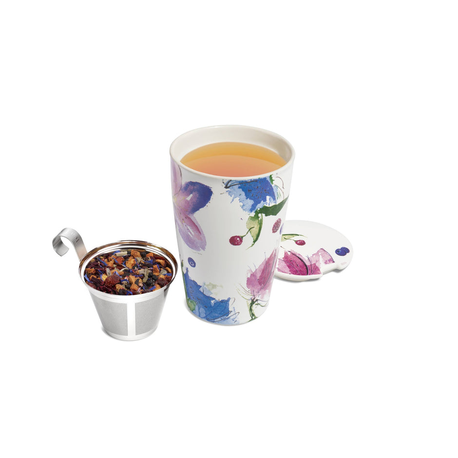 Tea Forte Herbal Retreat Kati Steeping Cup with floral design, infuser basket, and coaster on white background