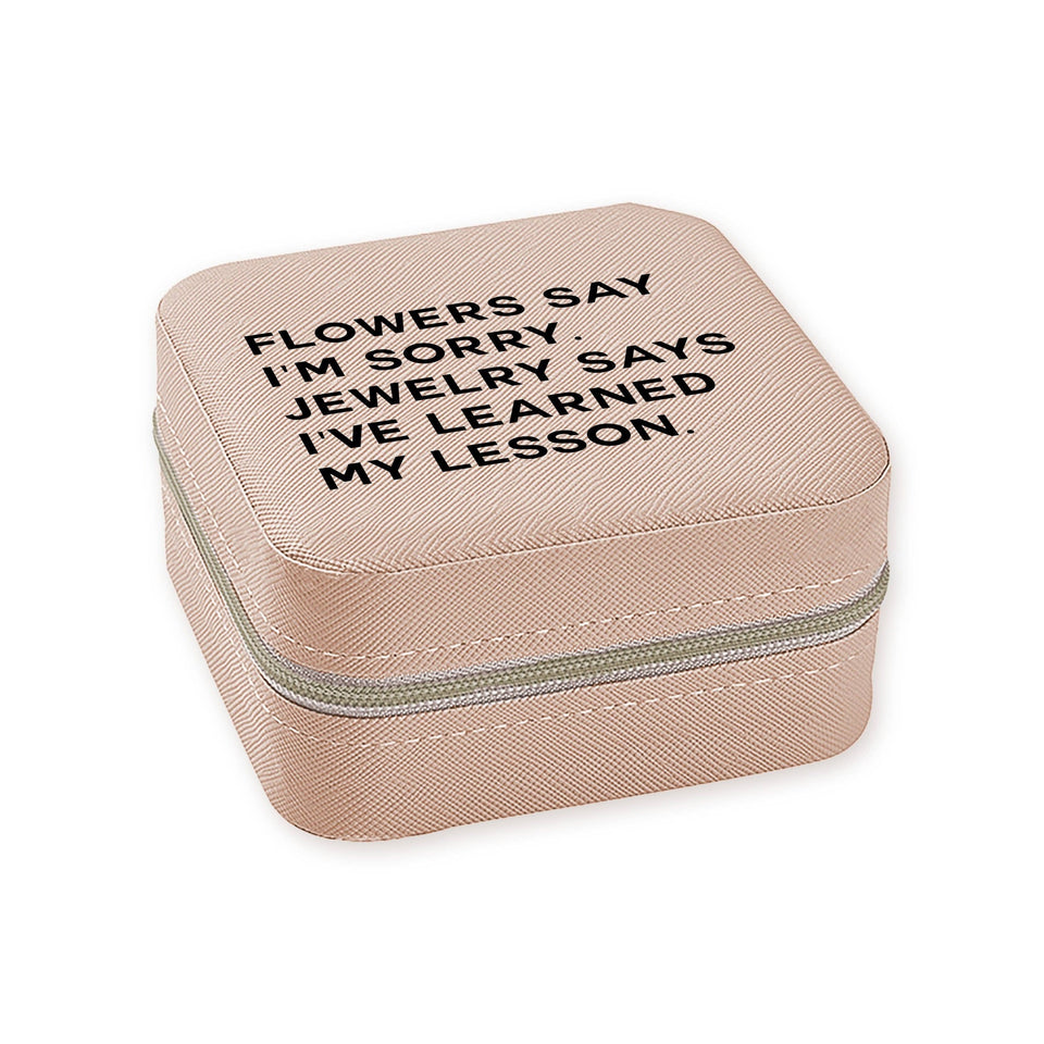 Ivory travel jewelry box with engraved text 'Flowers say I'm sorry, jewelry says I've learned my lesson'