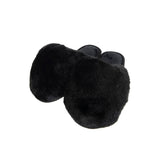 Black faux fur jumbo slippers for women by KATYDID, shown on white background