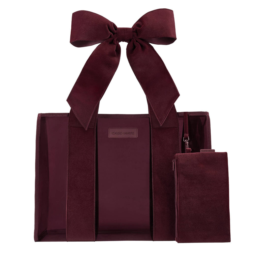 Burgundy velvet tote bag with matching bow detail and small pouch, displayed against white background.