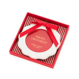 Red photo ornament in branded box with ribbon by Sugar Paper Los Angeles