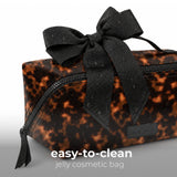 Tortoiseshell jelly cosmetic bag with black bow and easy-to-clean text overlay