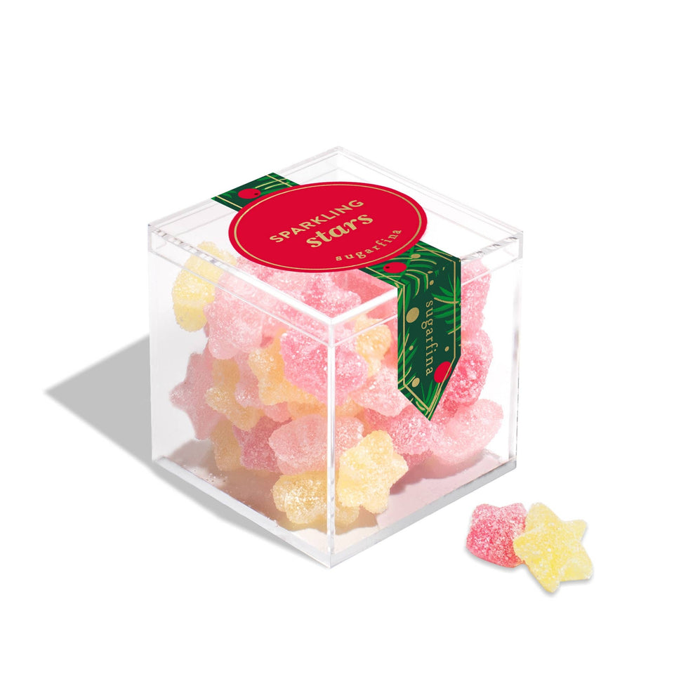 Sugarfina Sparkling Stars small box with pink and yellow star-shaped gummies on white background