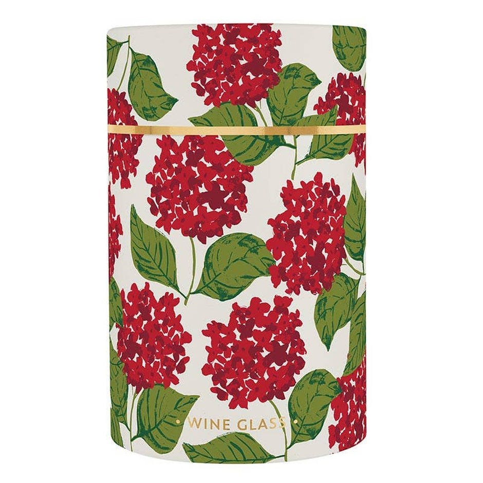 Wine glass in cylindrical tube packaging featuring red hydrangea floral design with green leaves