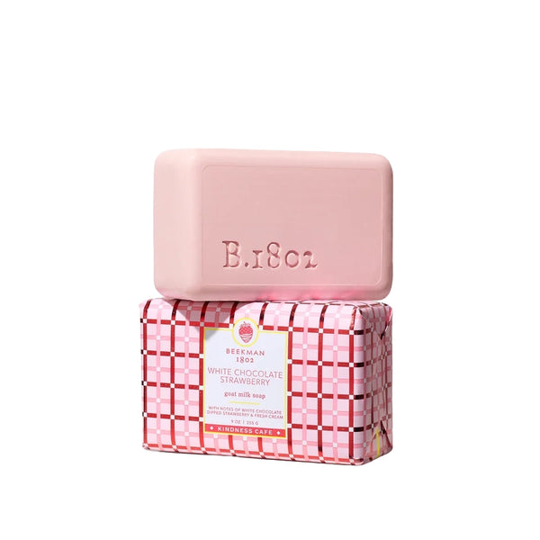 Pink White Chocolate Strawberry goat milk soap bar stacked on its pink plaid gift-wrapped box on a white background